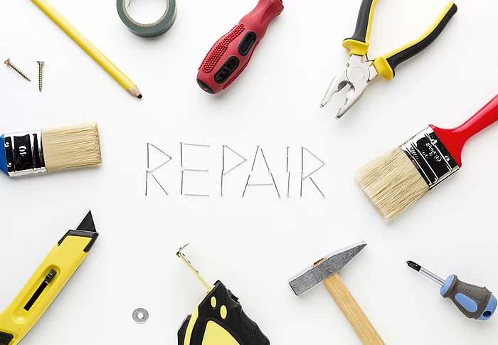 Bild mit Werkzeugen Schriftzug REPAIR